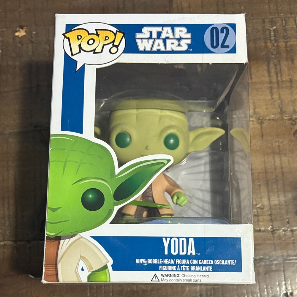 Pop Star Wars Yoda Figure in Green and Tan box has some damage as seen in photos